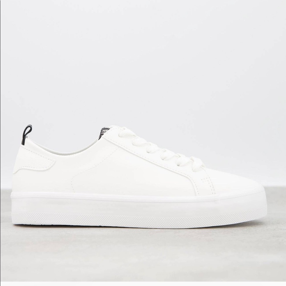 Flatform white sneakers with zebra print tab